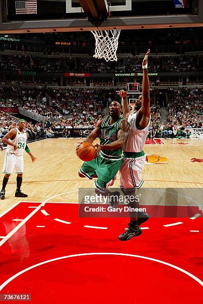 Ben Gordon of the Chicago Bulls takes the ball to the basket against Al Jefferson of the Boston Celtics during the game at the United Center on March...