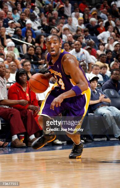 Kobe Bryant of the Los Angeles Lakers drives down the court on March 22, 2007 at FedExForum in Memphis, Tennessee. NOTE TO USER: User expressly...