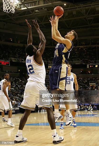 Levon Kendall of the Pittsburgh Panthers puts up a shot over Alfred Aboya of the UCLA Bruins during round three of the NCAA Men's Basketball...