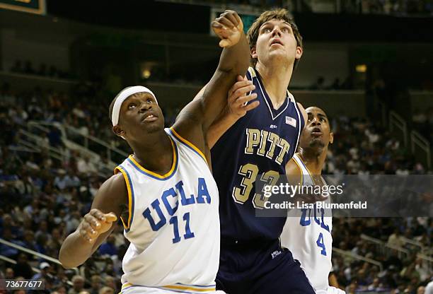 Ryan Wright of the UCLA Bruins battles for position with Aaron Gray of the Pittsburgh Panthers during round three of the NCAA Men's Basketball...