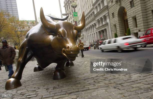 Bronze sculpture of a bull is displayed on Broadway in the financial district November 14, 2000 in New York City. The sculpture began as a practical...