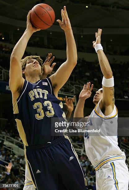 Aaron Gray of the Pittsburgh Panthers puts up a shot past Lorenzo Mata of the UCLA Bruins during round three of the NCAA Men's Basketball Tournament...