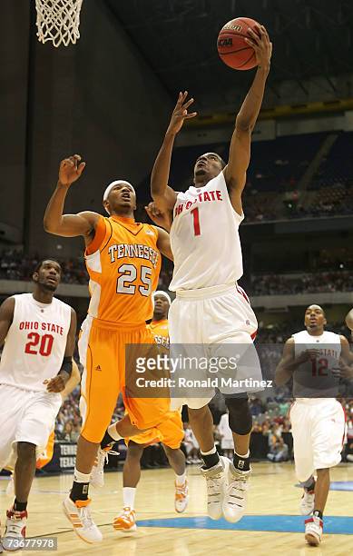 Mike Conley Jr. #1 of the Ohio State Buckeyes drives for a shot attempt against Josh Tabb of the Tennessee Volunteers during the round of 16 of the...