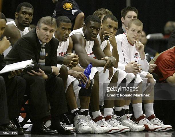 The Ohio State Buckeyes, including Greg Oden and Mike Conley Jr. #1 , look on from the bench against the Tennessee Volunteers during the round of 16...