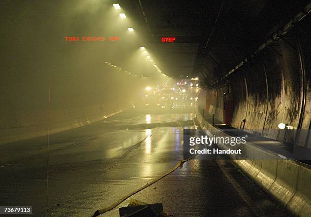 Tunnel water sprinklers assist in extingishing fires after a fatal collision inside Melbourne?s Burnley Tunnel on March 23, 2007 in Melbourne,...