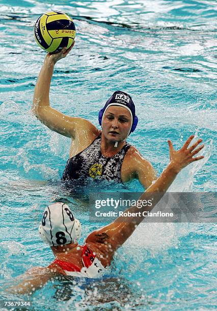 Noeki Klein of Netherlands looks to block the pass from Marina Gritsenko of Kazakhstan in the Women's Preliminary Round Group C Water Polo match...