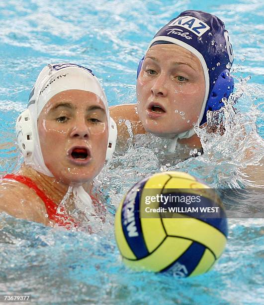 Simone Koot of Netherlands contests the ball with Kazakhstan's Anna Zubkova during the preliminary rounds of the women's water polo at the 12th Fina...
