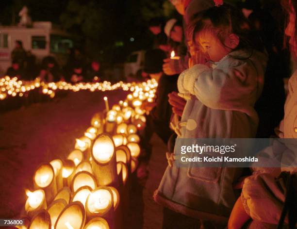 People light candles and pray for the souls of 6,432 victims of the 1995 Great Hanshin Earthquake at a ceremony marking the quake's sixth anniversary...