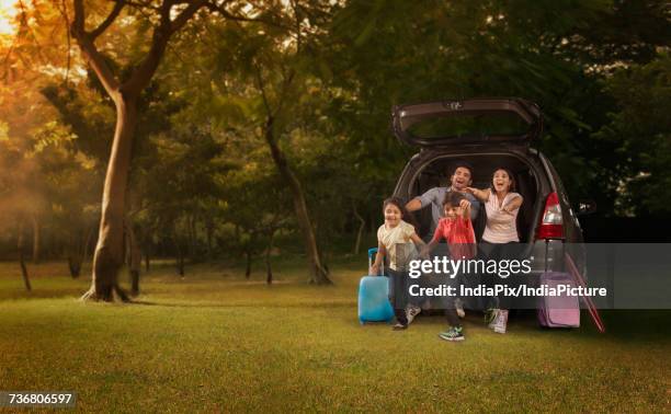 family having a picnic in the park - indian family vacation stock pictures, royalty-free photos & images