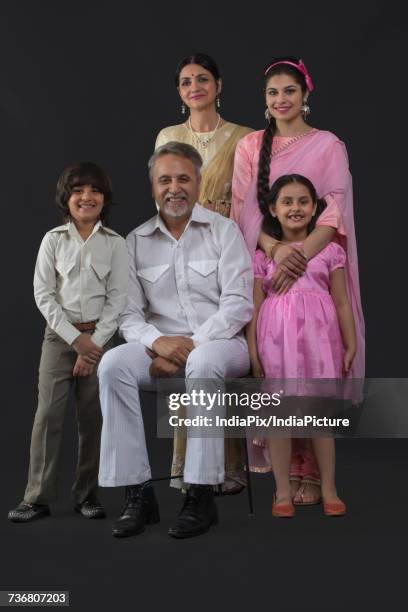 portrait of indian three generation family dressed in retro style - glamourous granny stock pictures, royalty-free photos & images