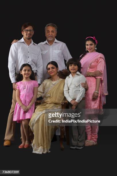 portrait of smiling indian multi-generation family dressed in retro style - glamourous granny stockfoto's en -beelden
