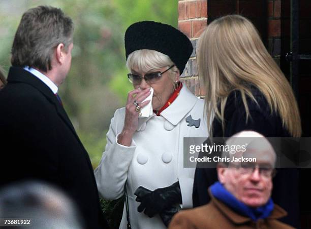 Wendy Richards wipes a tear from her eye as she attends the funeral of actor John Inman at Golders Green Crematorium on March 23, 2007 in London,...