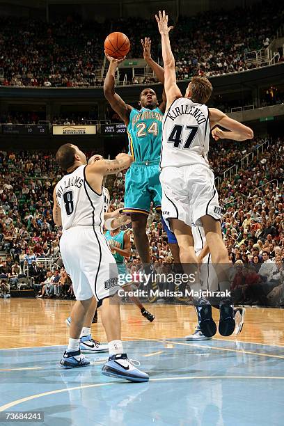 Desmond Mason of the New Orleans/Oklahoma City Hornets shoots against Andrei Kirilenko of the Utah Jazz during the game on March 10, 2007 at the...
