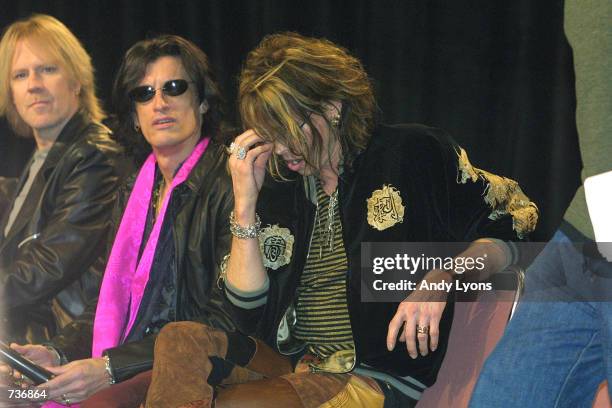 Lead singer Steve Tyler, center, and guitarist Joe Perry from the rock band Aerosmith attend a press conference for performers in the 2001 Super Bowl...