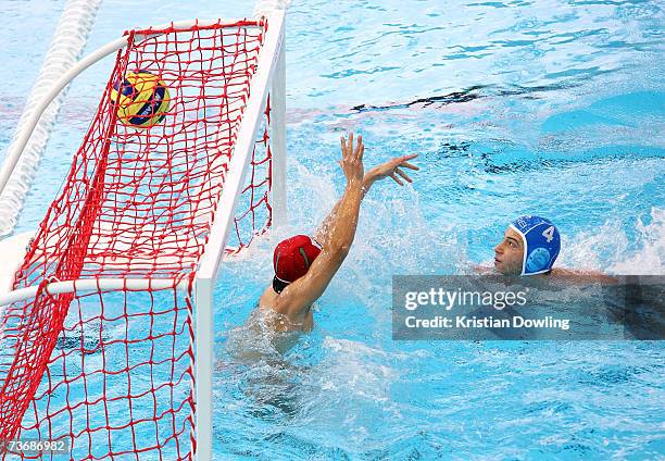 Vanja Udovicic of Serbia watches his shot hit the back of the net during the Men's Preliminary Water Polo match between Japan and Serbia at the...