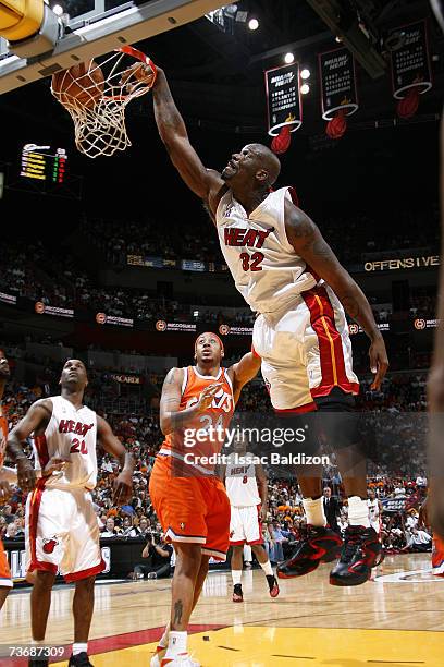 Shaquille O'Neal of the Miami Heat powers a dunk into the hoop during the NBA game against the Cleveland Cavaliers on February 25, 2007 at American...