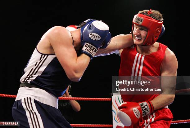 Tony Jeffries of England attacks Imre Szello of Hungary during the Amateur Boxing Association England v Hungary Tournament at the Newham Leisure...