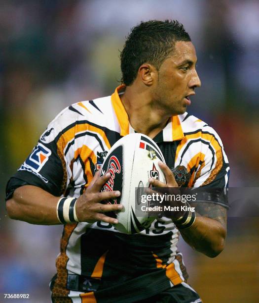 Benji Marshall of the Tigers looks to offload during the round two NRL match between the Wests Tigers and the Manly Warringah Sea Eagles at...