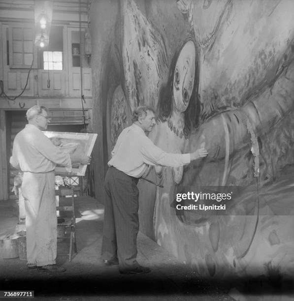Russian-born French painter, Marc Chagall working on the opening curtain for the New York City Ballet's production of 'The Firebird', by Igor...