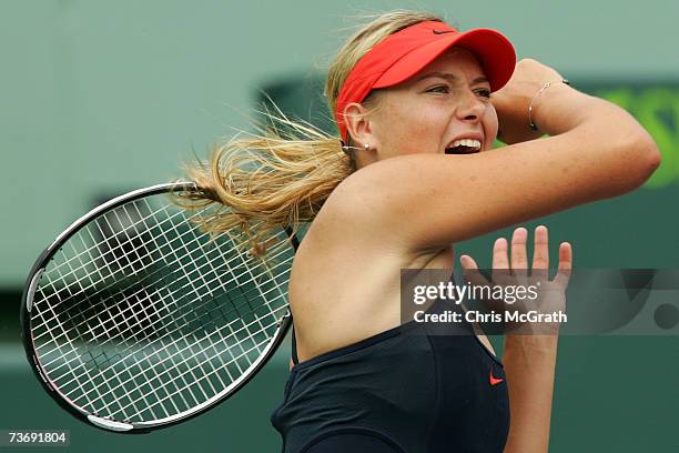 Maria Sharapova of Russia returns to Yung-Jan Chan of Chinese Taipei during day four at the 2007 Sony Ericsson Open at the Tennis Center at Crandon...