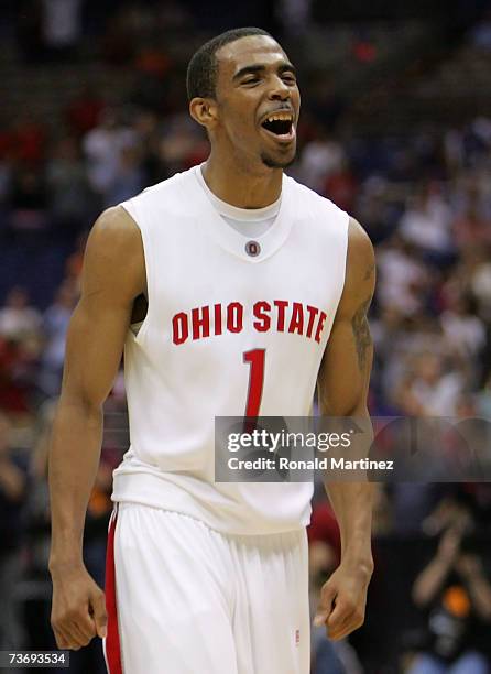 Mike Conley Jr. #1 of the Ohio State Buckeyes celebrates after Ohio Stae's 92-76 win against the Memphis Tigers during the south regional final of...