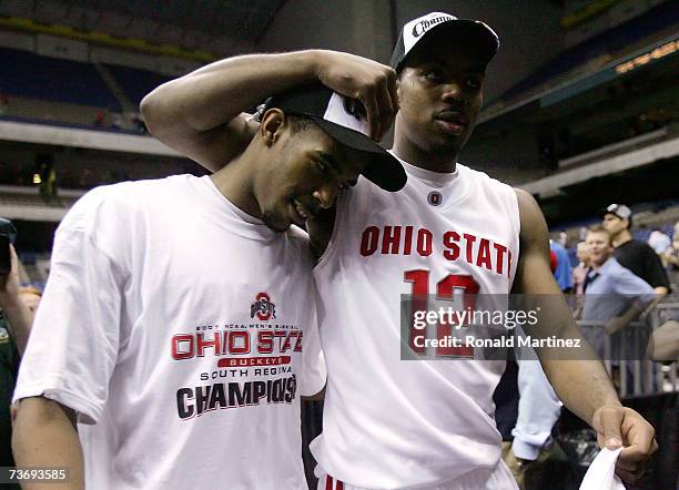 South region MVP Mike Conley Jr. #1 and Ron Lewis of the Ohio State Buckeyes walk off the court after their 92-76 win against the Memphis Tigers...