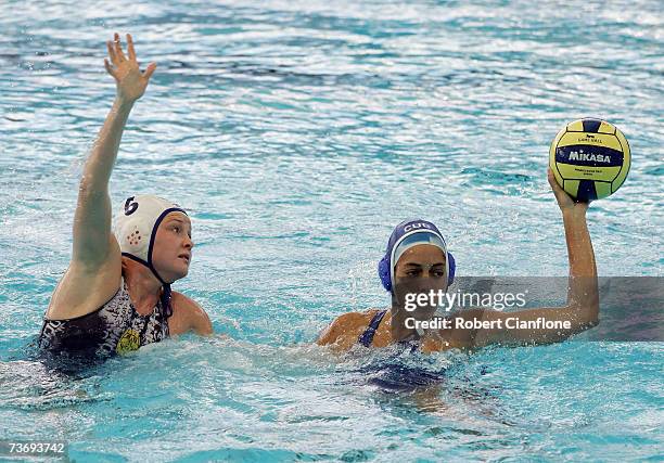 Yunieska Diago of Cuba makes a pass under pressure from Anna Zubkova of Kazakhstan during the Women's Final Round Water Polo match between Kazakhstan...