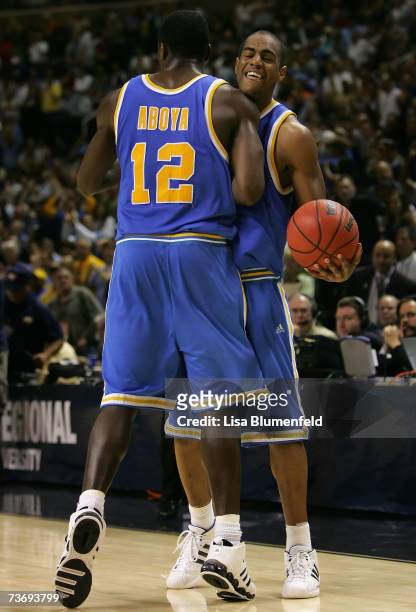 Arron Afflalo and Alfred Aboya of the UCLA Bruins celebrate after defeating the Kansas Jayhawks in the west regional final of the NCAA Men's...