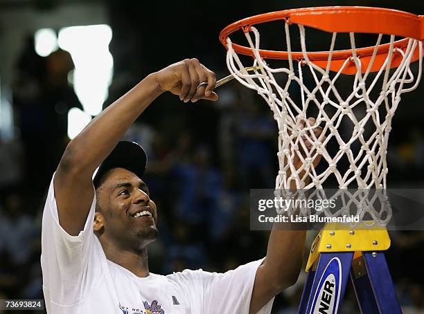 Arron Afflalo of the UCLA Bruins cuts down the net after winning the west regional final of the NCAA Men's Basketball Tournament against the Kansas...