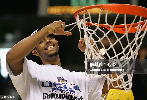 Josh Shipp of the UCLA Bruins cuts down the net after winning the west regional final of the NCAA Men's Basketball Tournament against the Kansas...