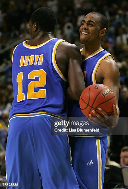 Arron Afflalo and Alfred Aboya of the UCLA Bruins celebrate after defeating the Kansas Jayhawks in the west regional final of the NCAA Men's...