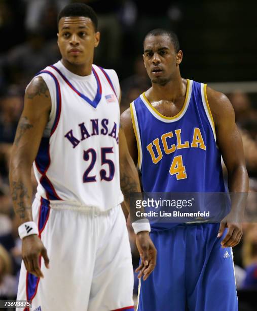 Arron Afflalo of the UCLA Bruins in action with Brandon Rush of the Kansas Jayhawks during the west regional final of the NCAA Men's Basketball...