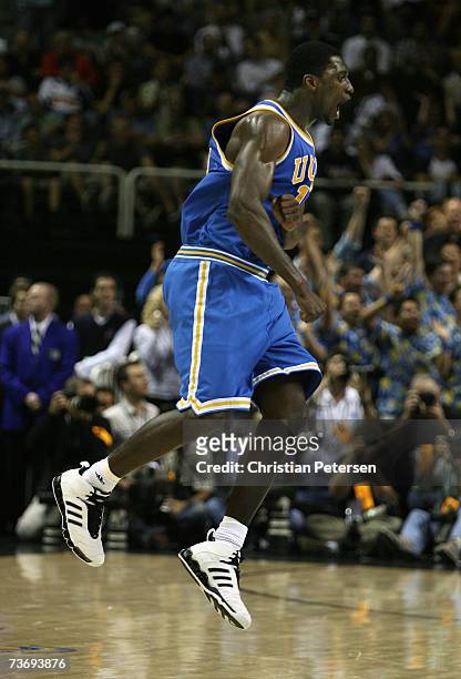 Alfred Aboya of the UCLA Bruins celebrates after defeating the Kansas Jayhawks in the west regional final of the NCAA Men's Basketball Tournament at...