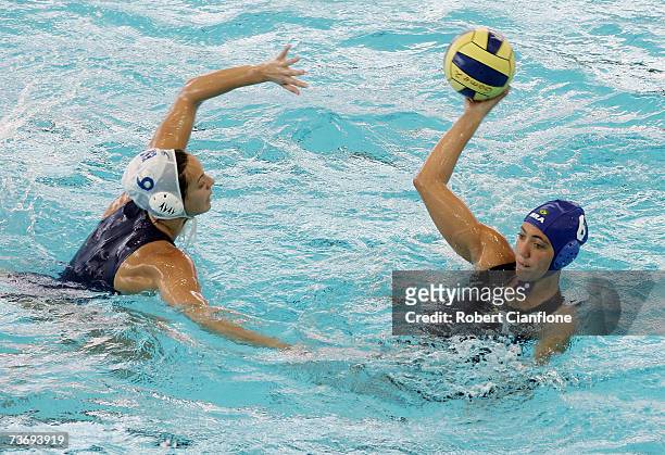 Cecilia Canetti of Brazil looks to pass with Jennifer Pareja Lisalde of Spain in defence during the Women's Final Round Water Polo match between...