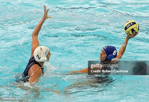 Cecilia Canetti of Brazil looks to pass with Blanca Gil Sorli of Spain in defence during the Women's Final Round Water Polo match between Spain and...