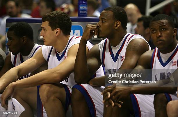 Members of the Kansas Jayhawks bench react during the final moments of the west regional final of the NCAA Men's Basketball Tournament against the...