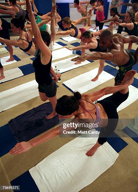 Students practice the unique Bikram Yoga at the City Studio, on