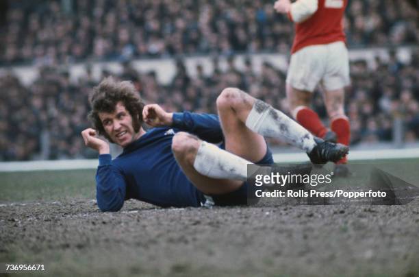 English professional footballer and striker with Chelsea Football Club, Peter Osgood pictured in action on the pitch during the League Division 1...