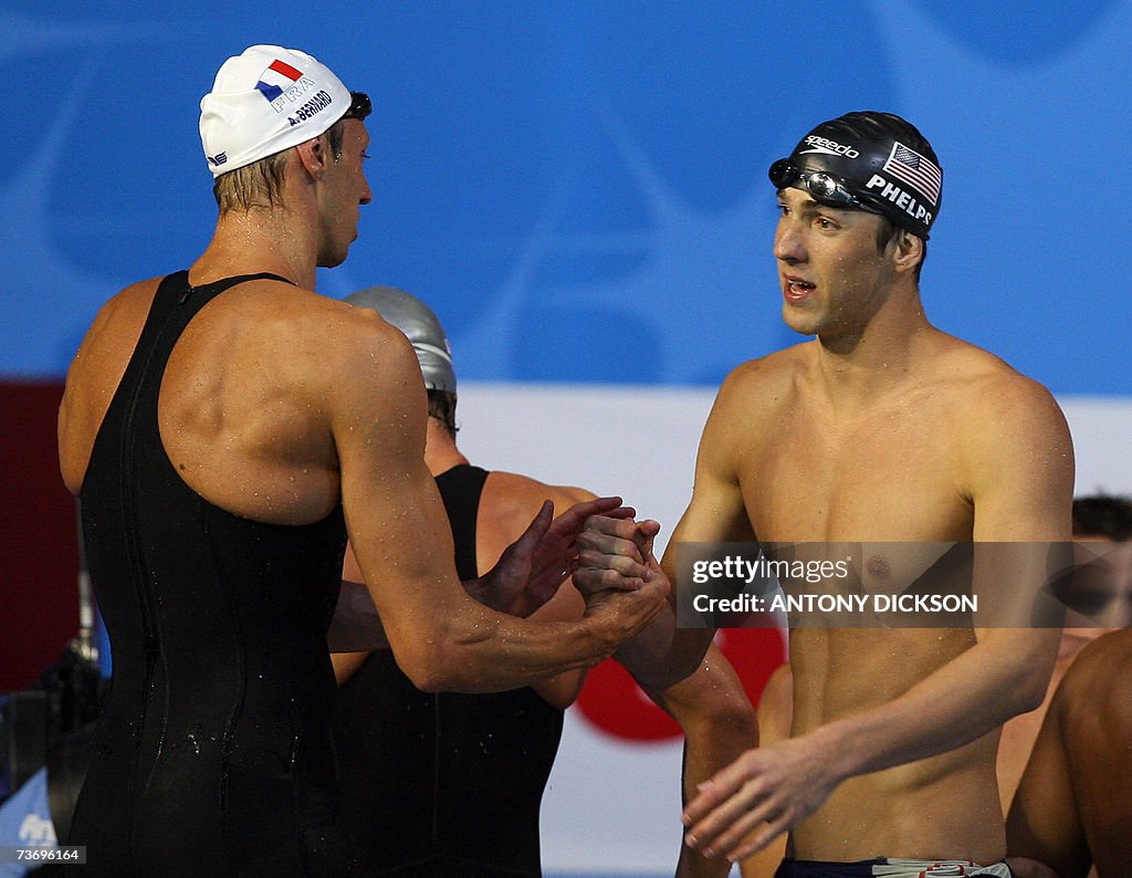 French Alain Bernard (L) shake hands wi...