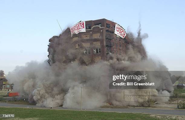 As four hundred pounds of explosives detonate, the old Lambert Pharmaceutical building implodes November 18, 2000 in St. Louis, Missouri. The old...