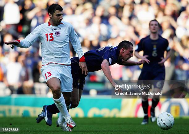 Scott Brown of Scotland is tackled by Zurub Khizanishvili of Georgia during the Euro2008, Group B, qualifier between Scotland and Georgia on March...