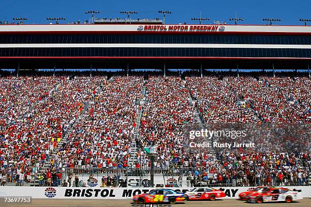 General view as Jeff Gordon, driver of the DuPont Chevrolet, leads Kasey Kahne, driver of the Dodge Dealers/UAW Dodge, Elliott Sadler, driver of the...