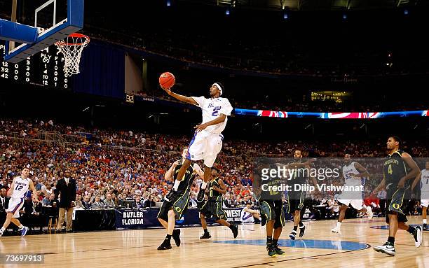 Corey Brewer of the Florida Gators goes in for a layup against the Oregon Ducks during the midwest regionals of the NCAA Men's Basketball Tournament...