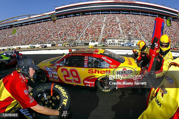 Kevin Harvick, driver of the Shell/Pennzoil Chevrolet, makes a pit stop during the NASCAR Nextel Cup Series Food City 500 at Bristol Motor Speedway...