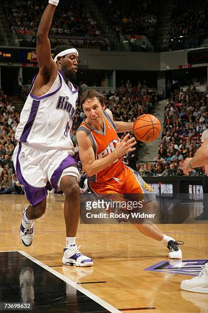 Steve Nash of the Phoenix Suns takes the ball to the basket around John Salmons of the Sacramento Kings on March 25, 2007 at ARCO Arena in...