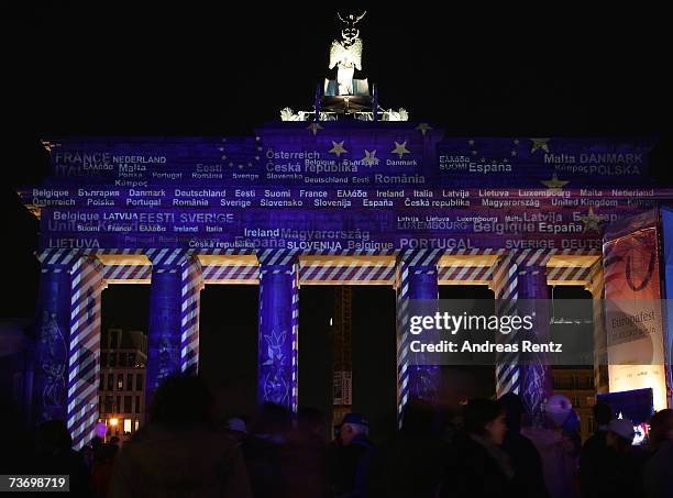 Berlin's Brandenburg Gate is illuminated during the 50th anniversary celebrations of the signing of the Treaty of Rome, March 25, 2007 in Berlin...