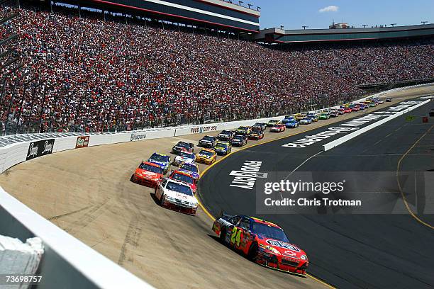 General view as Jeff Gordon, driver of the DuPont Chevrolet, leads Kasey Kahne, driver of the Dodge Dealers/UAW Dodge, and others, during the NASCAR...