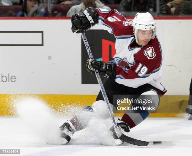 Joe Sakic of the Colorado Avalanche handles the puck during their game against the Vancouver Canucks at General Motors Place on March 25, 2007 in...