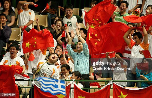 Chinese fans celebrate during the Women's 3m Synchro Springboard Final at the Melbourne Sports & Aquatic Centre during the Melbourne 2007 FINA World...