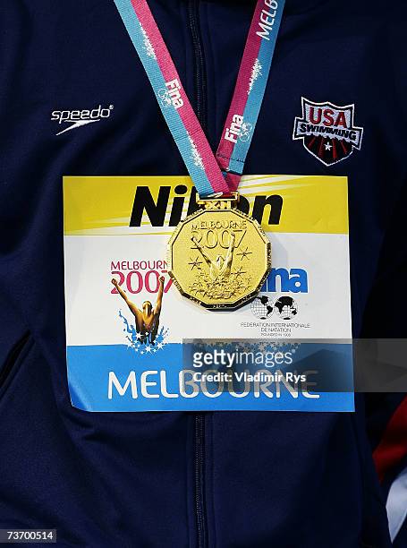 Detail of the gold medal as it hangs around the neck of Brendan Hansen of the United States of America after he won the Men's 100m Breaststroke...